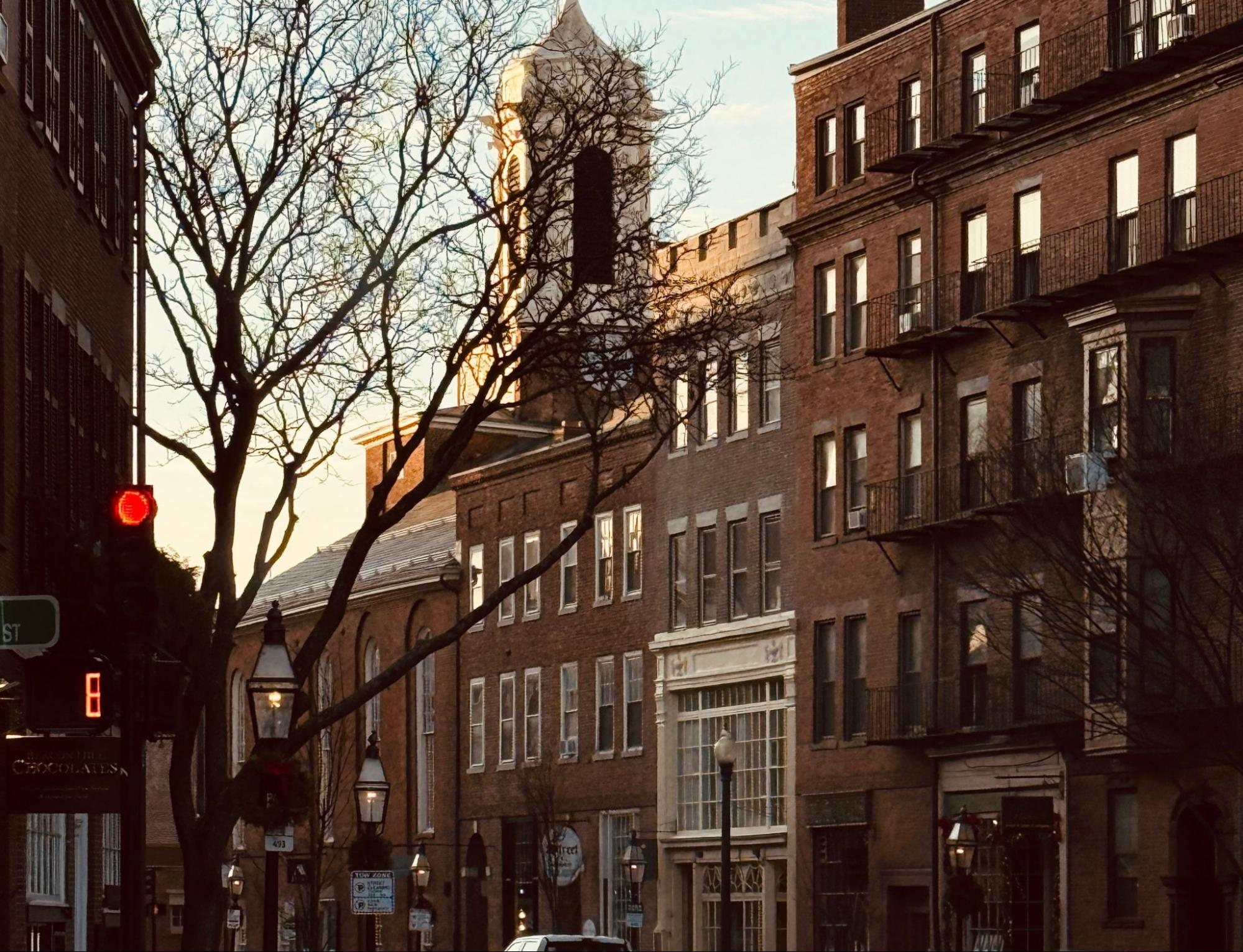 Historic brick rowhouses on a Charlestown, MA street served by masonry contractor Three Hills Masonry.